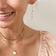 Female Model Wearing Flat Figaro Chain Necklace in Gold