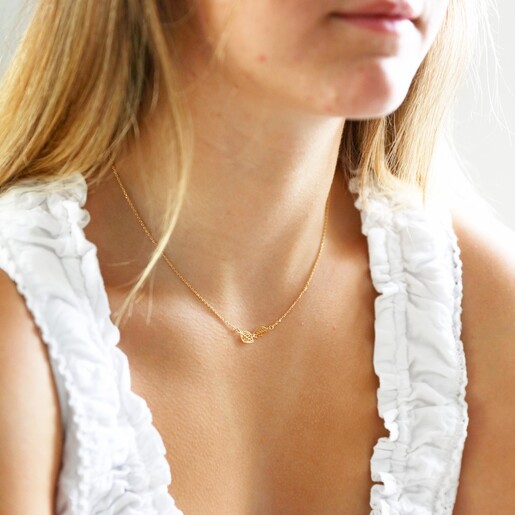 Model Wearing delicate Linked Filigree Leaf Necklace in Gold