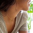 Model Wearing Lisa Angel Rainbow Crystal Edge Star Pendant Necklace in Gold
