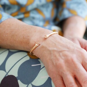 Adjustable Gold Hug Hands Bangle