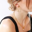 Blonde Model Wearing Tala Lani Gold Sterling Silver and Freshwater Pearl Statement Earrings