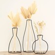 Group of Three Black Metal Wire Outline Vases