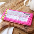 Back of Tony's Chocolonely White Chocolate Raspberry Popping Candy Bar