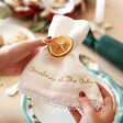 Model Holding Personalised Embroidered White Linen Napkin
