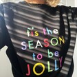 Close up of Model Wearing Tis The Season to be Jolly Sweatshirt in Black