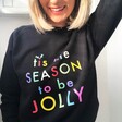 Model Wearing Festive Tis The Season to be Jolly Sweatshirt in Black