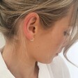 Lisa Angel Small Ladies' Mini Sterling Silver Star Huggie Hoop Earrings on Model