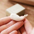 Model Holding East of India Matchbox Whale Ornament