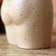 Close Up of Small Ceramic Speckled Bum Vase