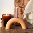 Terracotta Arch Candlestick Holder with Lit Candle