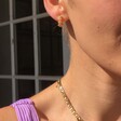 Female Model Wearing Crystal Daisy Hoop Earrings in Gold