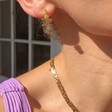 Picture of Model Wearing Crystal Daisy Hoop Earrings in Gold