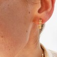 Model Wearing Crystal Daisy Hoop Earrings in Gold