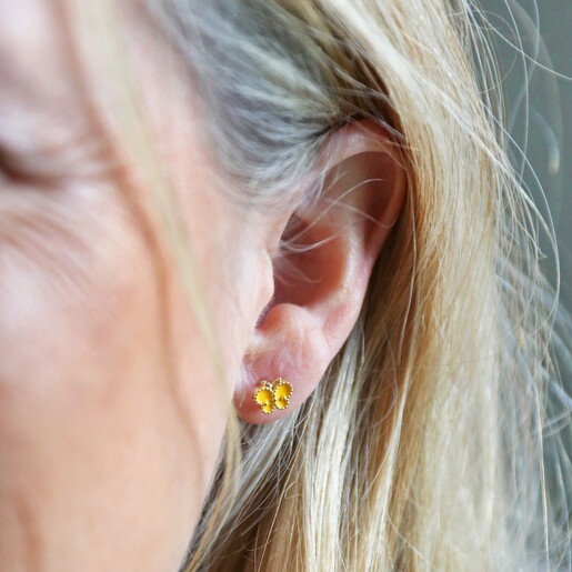 Model Wearing Enamel Butterfly Stud Earrings in Gold