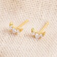Ladies' Tiny Crystal Moon Stud Earrings in Gold on Linen Fabric