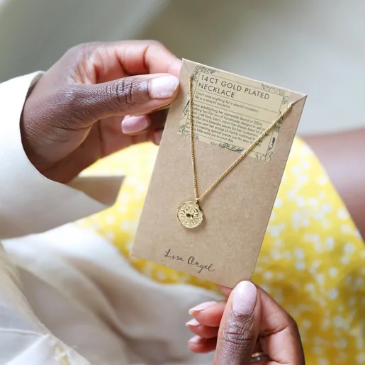 Gold Stainless Steel Aquarius Pendant Necklace in Packaging