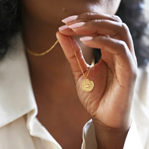 Gold Stainless Steel Aquarius Pendant Necklace on Model