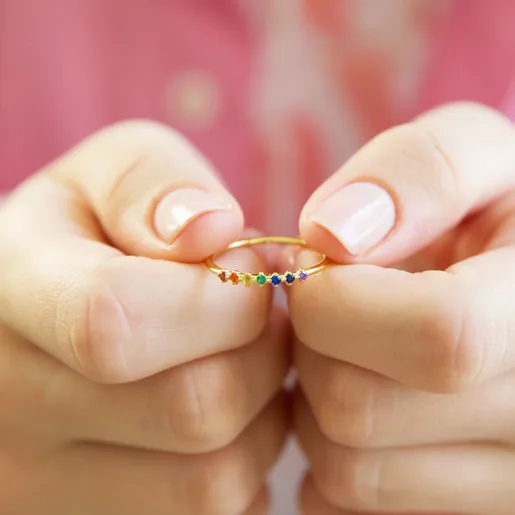 Model Holding Hypoallergenic Gold Sterling Silver Rainbow Crystal Band Ring