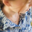 Model Wearing Ladies' Tiny Interlocking Hearts Necklace in Rose Gold