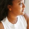 Delicate Opal Turtle Charm Necklace in Gold on Model