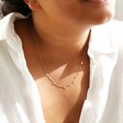 Model Wearing Delicate Stainless Steel Heart Charm Necklace in Rose Gold