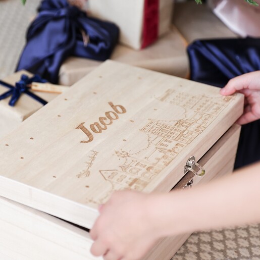 Hands Opening the Personalised Festive Houses Wooden Hamper Box