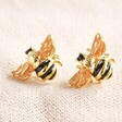 Small Bee Stud Earrings Positioned Angled on Cloth