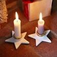 Two Ceramic Star Candlestick Holders with Candles