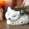 Close Up of Small Ceramic Sleeping Fox Planter