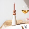 White and Terracotta Candlestick Holder on Table