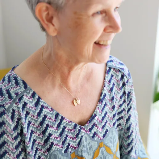 Model Wears Ladies' Personalised 60th Birthday Double Heart and Birthstone Necklace From Lisa Angel