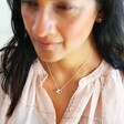 Female Model Wearing Delicate Personalised Mini Sterling Silver Heart Necklace with Swarovski Crystal
