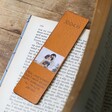 Personalised Anniversary Photo Leather Bookmark Resting on a Book