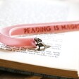 Close Up of Pink Personalised Dinosaur Charm and Ribbon Bookmark
