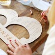 Guest Signing the Personalised Large Wooden Wedding Letter