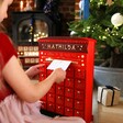 Personalised Fill Your Own Postbox Advent Calendar Being Used to Post Letter
