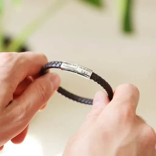 Model Holding Men's Personalised Anniversary Woven Bracelet