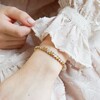 Close Up of Lisa Angel Beaded Hearts Bracelet in Silver, Rose Gold and Gold On Model