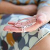 Lisa Angel 'Nana' Meaningful Word Bangle in Silver in Models Hand