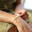 Model Wearing Lisa Angel Gold Personalised 'Handwriting' Curved Bar Bracelet with Birthstone