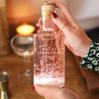 Model Holding Personalised Snow Globe Light Up 50cl Bottle of Alcohol