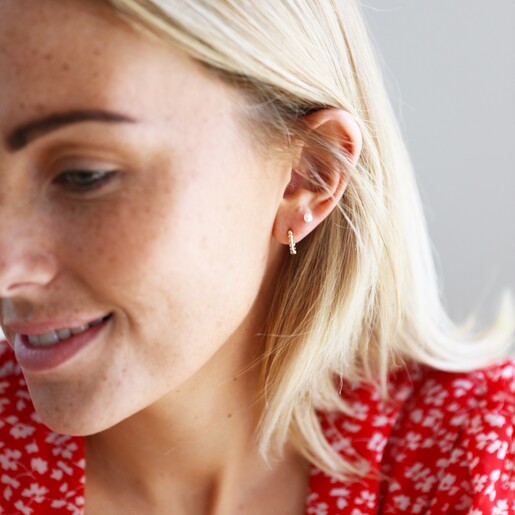 Model Wearing Lisa Angel Gold Sterling Silver Dotted Huggie Hoop Earrings