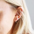 Close Up of Model Wearing Lisa Angel Gold Sterling Silver Dotted Huggie Hoop Earrings