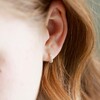 Close Up of Lisa Angel Sterling Silver Dotted Huggie Hoop Earrings on Model