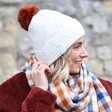 Model Wearing Natural Marled Winter Hat with Terracotta Pom Pom