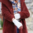 Model Wearing Soft Knitted Hand Warmers in Marled Cream