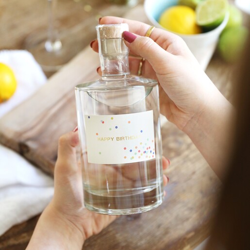 Model Holding Personalised Confetti Label Bottle of Alcohol