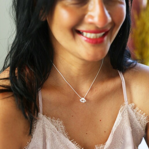 Model Wearing Lisa Angel Personalised Mini Sterling Silver Family Names Heart Necklace