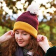Powder Bonnie Bobble Hat in Damson and Mustard on Model