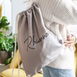 Model Wears Personalised Name Organic Cotton Drawstring Bag